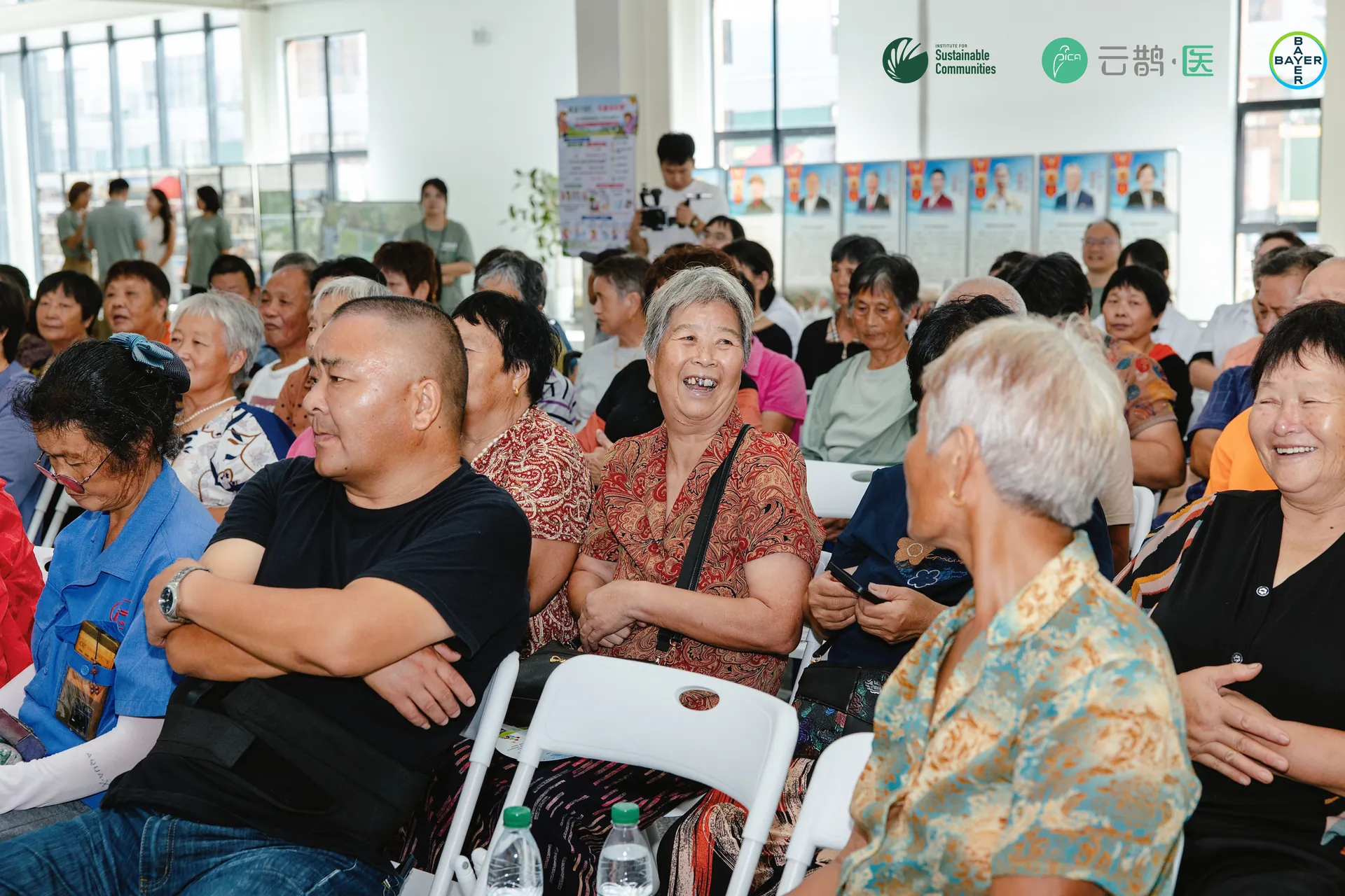 Residents listening during the community training