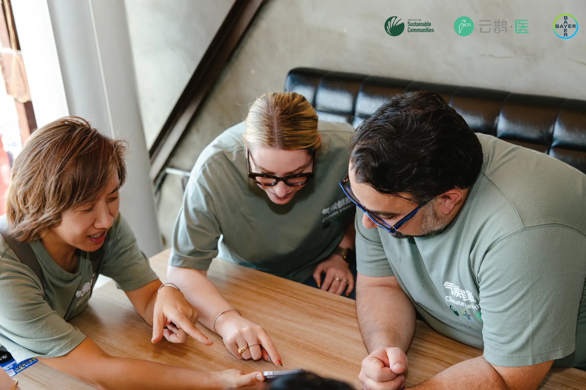 Programme team members reviewing the session plan around a table