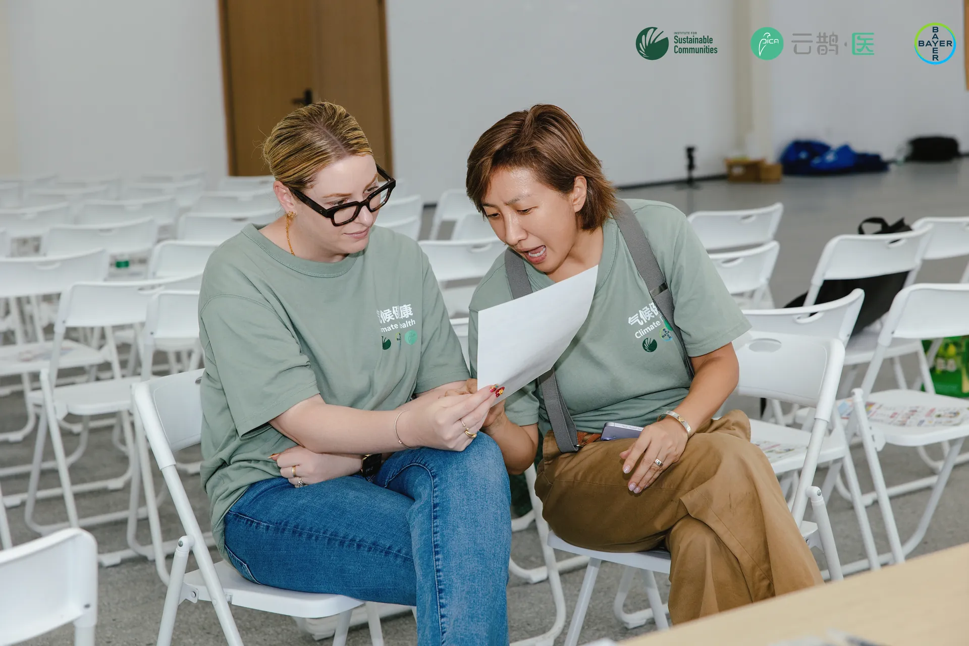 Two programme team members debriefing after the session