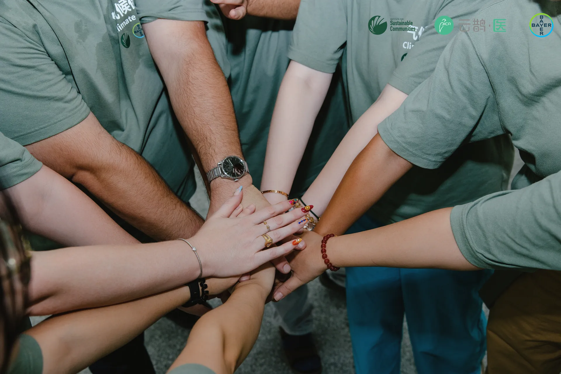 Programme partners placing their hands together at the close of the day